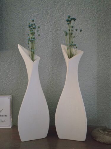 White slab pottery vases with dried flowers